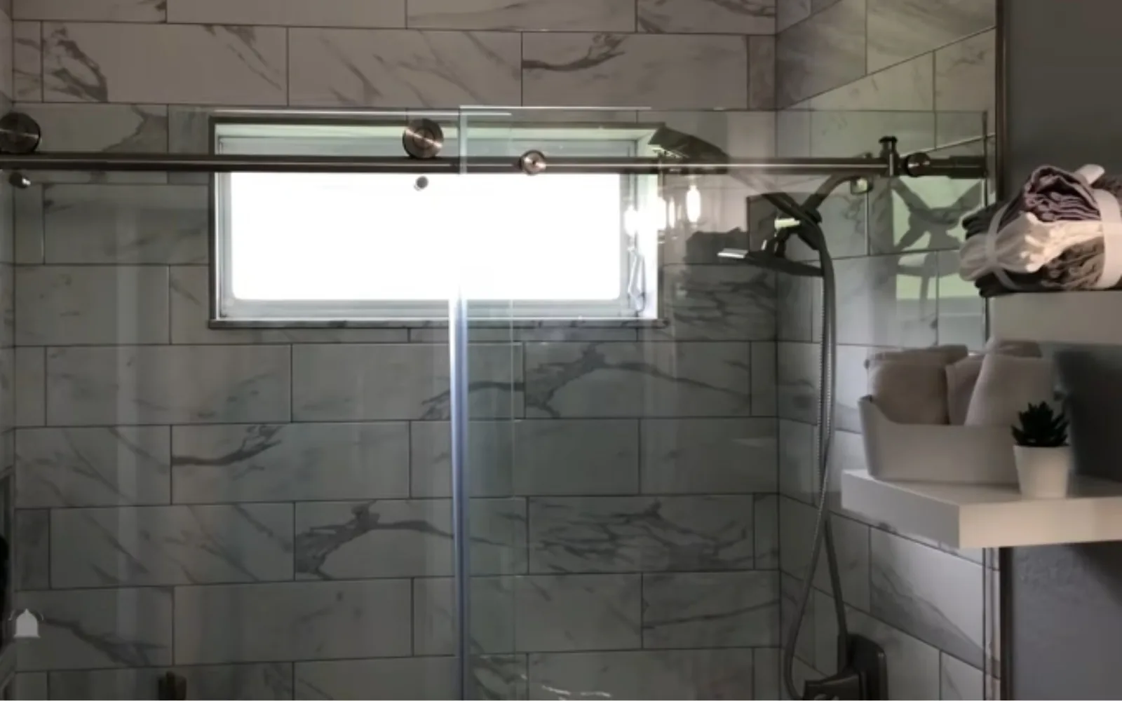 New shower enclosure installation with tile surround in progress